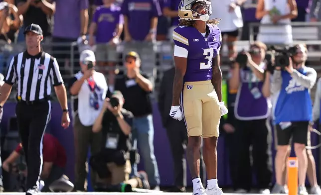 Washington wide receiver Rashid Williams (3) reacts to scoring a touchdown against Washington State during the second half of an NCAA college football game, Sunday, Sept. 6, 2026, in Seattle. (AP Photo/Lindsey Wasson)