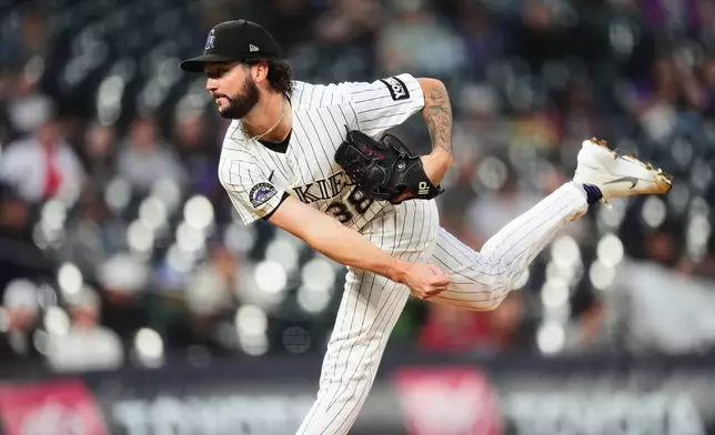 Colorado Rockies starting pitcher Mason Adams works against the Arizona Diamondbacks in the first inning of a baseball game Wednesday, Sept. 23, 2026, in Denver. (AP Photo/David Zalubowski)