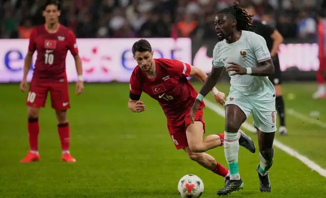 France's Manu Kone in action in front of Turkey's İsmail Yuksek during the UEFA Nations League soccer match between Turkey and France in Izmit, Turkey, Friday, Sept. 25, 2026. (AP Photo/Khalil Hamra)