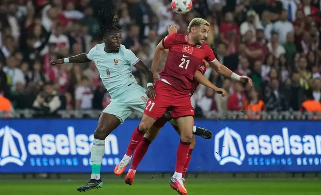 France's Manu Kone, left, and Turkey's Barıs Alper Yılmaz jump for the ball during the UEFA Nations League soccer match between Turkey and France in Izmit, Turkey, Friday, Sept. 25, 2026. (AP Photo/Khalil Hamra)