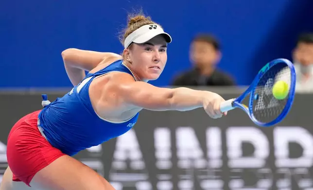 Czech Republic's Linda Noskova returns the ball to Spain's Cristina Bucsa during the Billie Jean King Cup women's singles semifinal tennis match between Spain and Czech Republic, in Shenzhen, China, Friday, Sept. 25, 2026. (AP Photo/Andy Wong)
