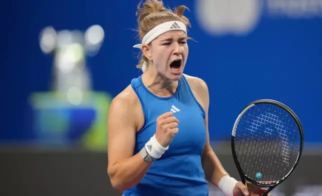 Czech Republic's Karolina Muchova celebrates a point against Spain's Jessica Bouzas Maneiro during the Billie Jean King Cup women's singles semifinal tennis match between Spain and Czech Republic, in Shenzhen, China, Friday, Sept. 25, 2026. (AP Photo/Andy Wong)