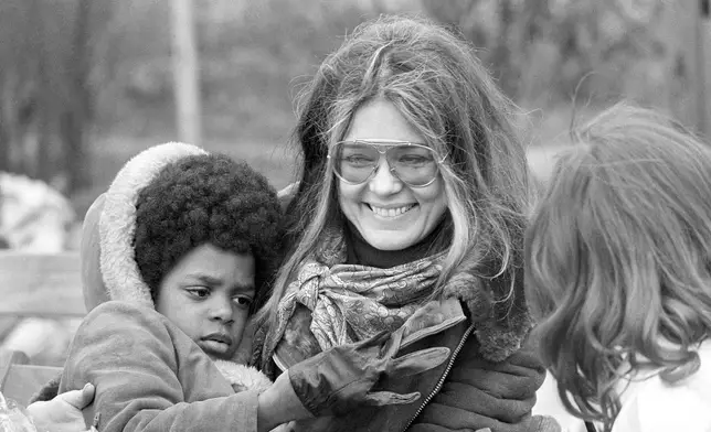 Women's rights leader Gloria Steinem is shown at a rally of welfare demonstrators on the Washington Monument grounds after a march past the White House, March 25, 1972. (AP Photo/Charles Harrity, File)