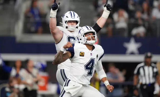 Dallas Cowboys quarterback Dak Prescott (4) celebrates after throwing a pass for a touchdown against the Washington Commanders in the second half during an NFL football game in Arlington, Texas, Sunday, Sept. 20, 2026. (AP Photo/Tony Gutierrez)
