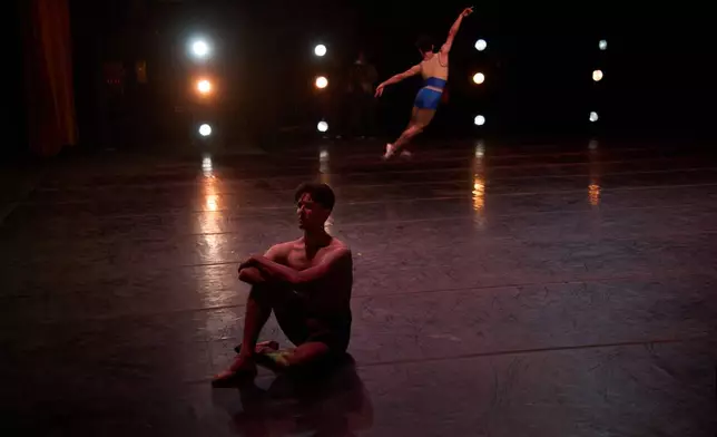 Dani Hernandez, principal dancer of the National Ballet of Cuba and director of the National Ballet School, sits on stage during rehearsal in Havana, Cuba, Friday, Aug. 21, 2026. (AP Photo/Ramon Espinosa)