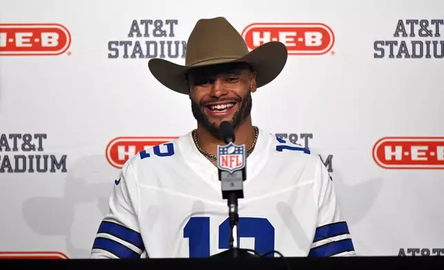 Dallas Cowboys quarterback Dak Prescott speaks in a press conference after an NFL football game against the Washington Commanders in Arlington, Texas, Sunday, Sept. 20, 2026. (AP Photo/Jessica Tobias)