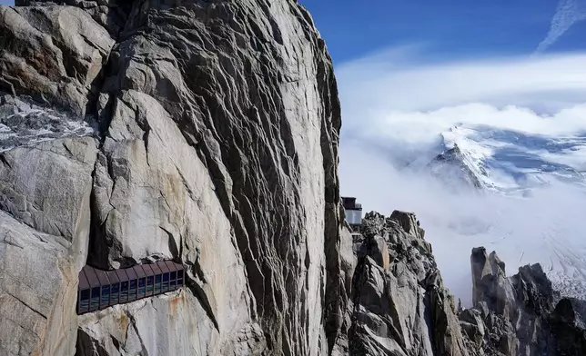 The Mont-Blanc massif mountains are seen from the Aiguille du Midi in Chamonix, France, Saturday, Sept. 5, 2026. (AP Photo/Laurent Cipriani)