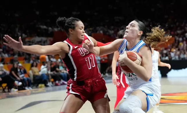 Napheesa Collier, of the United States, guards Italy's Lorela Cubaj during the Women's Basketball World Cup match between the United States and Italy in Berlin, Sunday, Sept. 6, 2026. (AP Photo/Ebrahim Noroozi)