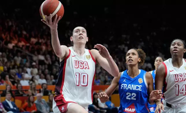 Breanna Stewart, of the United States, scores during the Women's Basketball World Cup final match between the United States and France in Berlin, Sunday, Sept. 13, 2026. (AP Photo/Ebrahim Noroozi)
