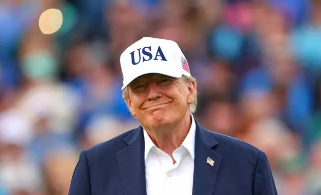 U.S. President Donald Trump smiles after the trophy presentation of the Irish Open at the Trump International Golf Links course in Doonbeg, Ireland, Sunday, Sept. 13, 2026.(AP Photo/Peter Morrison)