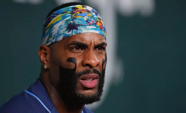 Tampa Bay Rays' Yandy DÌaz sits in the dugout prior to a baseball game against the Texas Rangers, Thursday, Sept. 3, 2026, in Arlington, Texas. (AP Photo/Julio Cortez)