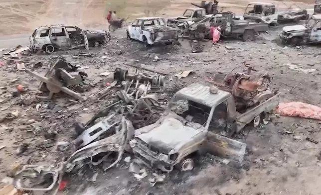 This image taken from undated video released by the Houthi-run Al-Masirah television channel on Saturday, Sept. 12, 2026, shows damaged vehicles on a road between the Dhubab and Amri junctions in Yemen, according to the channel. (Al-Masirah TV via AP)