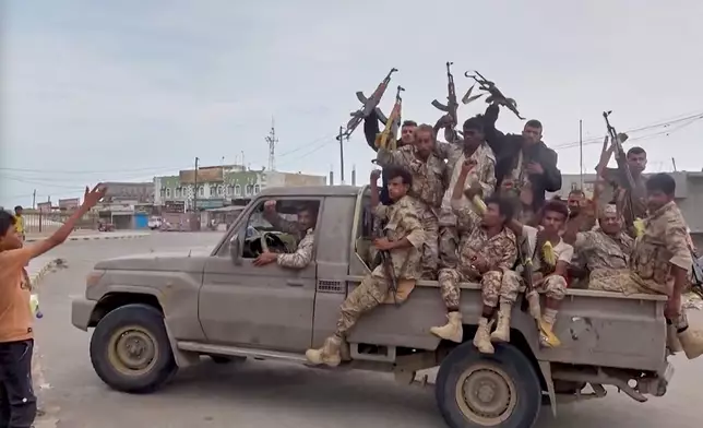 This image taken from undated video released by Al-Masirah TV, a channel owned by Yemen's Houthi rebels, on Friday, Sept. 11, 2026, shows, according to the channel, Houthi fighters chanting atop a pickup truck in Khawkhah, Hodeida province, Yemen. (Al-Masirah TV via AP)