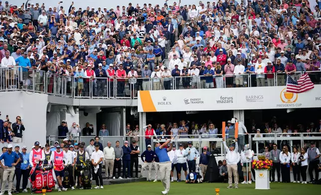 USA teams' Scottie Scheffler hits from the first tee during the first round four-ball match at the Presidents Cup golf tournament against the International team at Medinah Country Club, Thursday, Sept. 24, 2026, in Medinah, Ill. (AP Photo/Matt Slocum)