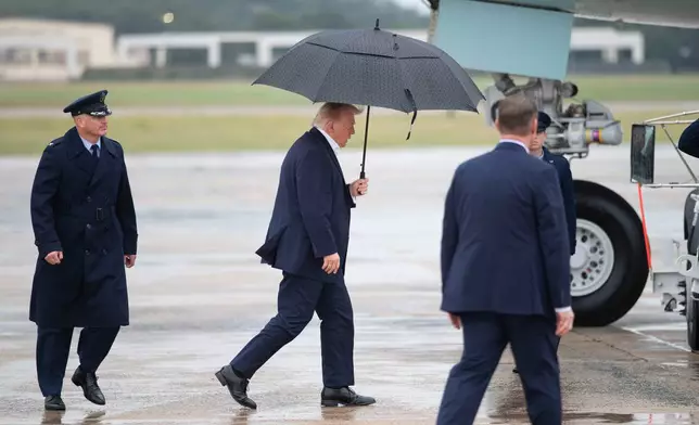 President Donald Trump walks to board Air Force One at Joint Base Andrews, Md., Sunday, Sept. 27, 2026. (AP Photo/Cliff Owen)