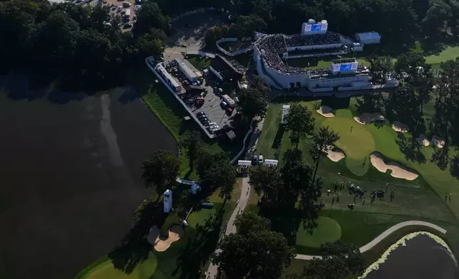 Air Force One, with President Donald Trump on board, flies over the Presidents Cup golf tournament at Medinah Country Club, Sunday, Sept. 27, 2026, in Medinah, Ill. (AP Photo/Julia Demaree Nikhinson)
