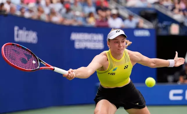 Qinwen Zheng, of China, returns the ball to Elena Rybakina, of Kazakhstan, during the quarterfinal round of the U.S. Open tennis championships, Wednesday, Sept. 9, 2026, in New York. (AP Photo/Seth Wenig)