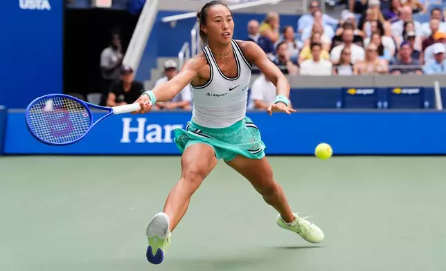 Qinwen Zheng, of China, returns the ball to Elena Rybakina, of Kazakhstan, during the quarterfinal round of the U.S. Open tennis championships, Wednesday, Sept. 9, 2026, in New York. (AP Photo/Seth Wenig)