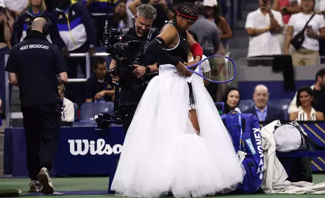 Naomi Osaka, of Japan, arrives to compete against Anastasia Zakharova, of Russia, during the first round of the U.S. Open tennis championships Monday, Aug. 31, 2026, in New York. (AP Photo/Adam Hunger)