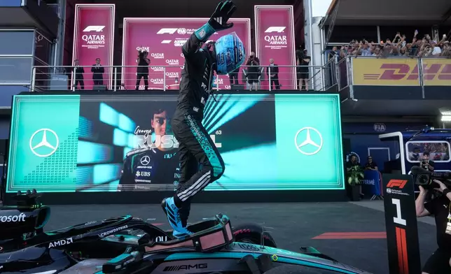 Mercedes driver George Russell of Britain celebrates after winning the Azerbaijan F1 Grand Prix auto race, in Baku, Azerbaijan, Saturday, Sept. 26, 2026. (AP Photo/Pavel Bednyakov)