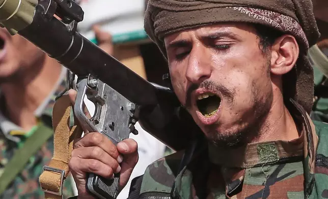 A Yemen's Houthi rebel chews Qat as he marches during a mobilization campaign in Sanaa, Yemen, Thursday, Sept. 10, 2026. (AP Photo)