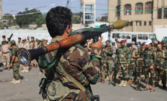 A fighter with Yemen’s Houthi rebels carries a rocket-propelled grenade launcher as they march during a mobilization campaign in Sanaa, Yemen, Thursday, Sept. 10, 2026. (AP Photo)