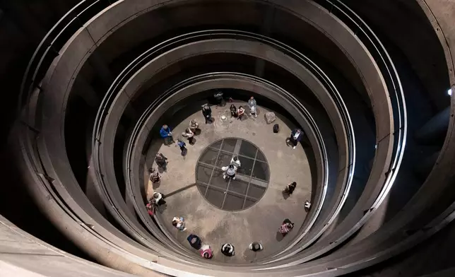 People yodel during a public event in an underground garage in Graz, Austria, on Wednesday, Sept. 23, 2026. (AP Photo/Denes Erdos)