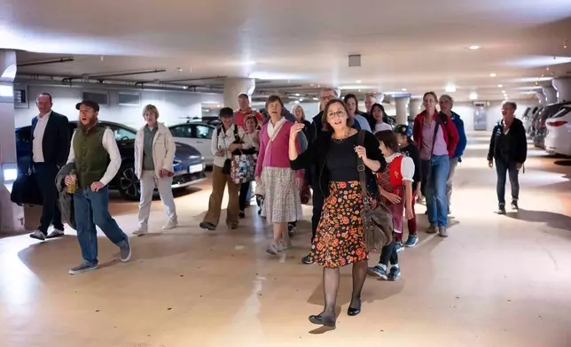 People yodel during a public event in an underground garage in Graz, Austria, on Wednesday, Sept. 23, 2026. (AP Photo/Denes Erdos)