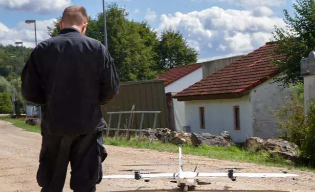 A U.S. Army solider gets ready to launch a drone at the Hohenfels training center in Germany as part of the annual training exercise taking place at the facility in Hohenfels, Germany, Aug. 29, 2026. (AP Photo/Konstantin Toropid)