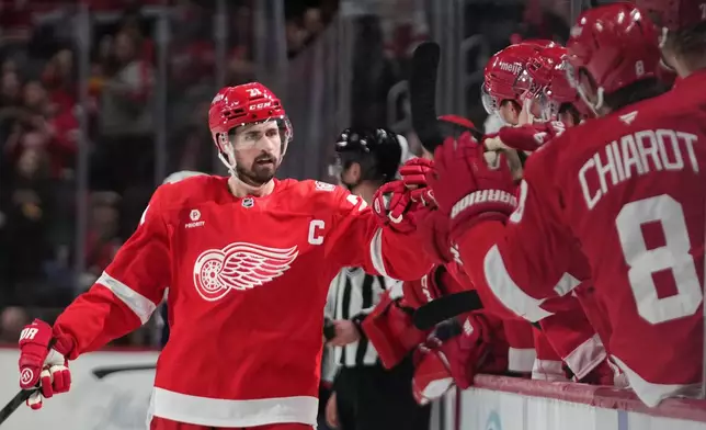 FILE - Detroit Red Wings center Dylan Larkin celebrates his goal against the Columbus Blue Jackets in the first period of an NHL hockey game in Detroit, April 7, 2026. (AP Photo/Paul Sancya, File)