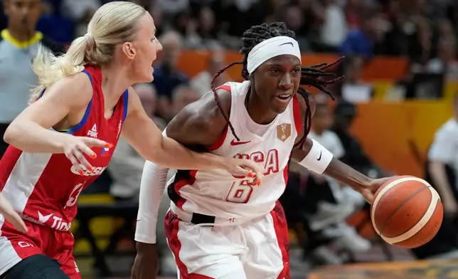 Czechia's Petra Holesinska guards Rhyne Howard, of the United States, during the Women's Basketball World Cup match between the United States and Czechia in Berlin, Monday, Sept. 7, 2026. (AP Photo/Ebrahim Noroozi)