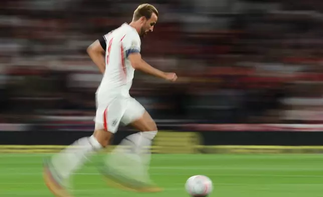 England's Harry Kane takes the ball forward during the Nations League Soccer match between England and Spain in London, Saturday, Sept. 26, 2026. (AP Photo/Ian Walton)