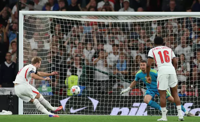 England's Harry Kane takes a penalty kick but fails to score during the Nations League Soccer match between England and Spain in London, Saturday, Sept. 26, 2026. (AP Photo/Ian Walton)