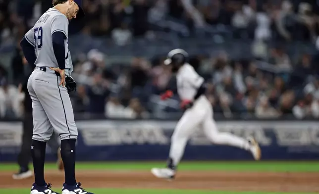 Tampa Bay Rays pitcher Mason Englert reacts after giving up a solo home run to New York Yankees' George Lombard Jr. during the third inning of a baseball game Wednesday, Sept. 23, 2026, in New York. (AP Photo/Adam Hunger)