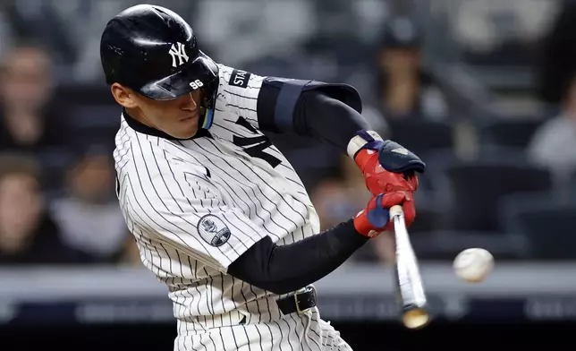 New York Yankees' George Lombard Jr. hits a two-run home run during the eighth inning of a baseball game against the Tampa Bay Rays, Thursday, Sept. 24, 2026, in New York. (AP Photo/Adam Hunger)