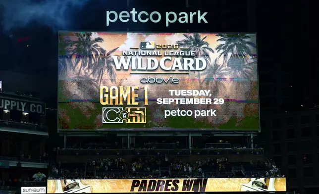 The score board at Petco Park showing the San Diego Padres will host the Chicago Cubs on Sept. 29 for the National League Wild Card series Saturday, Sept. 26, 2026, in San Diego. (AP Photo/Karl Anderson)