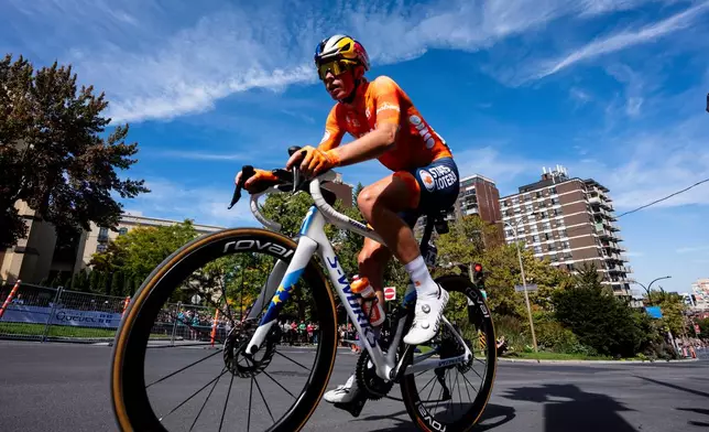 Demi Vollering, of the Netherlands, competes in the women's elite road race at the UCI Road World Championships cycling event in Montreal, Saturday, Sept. 26, 2026. (Christopher Katsarov/The Canadian Press via AP)