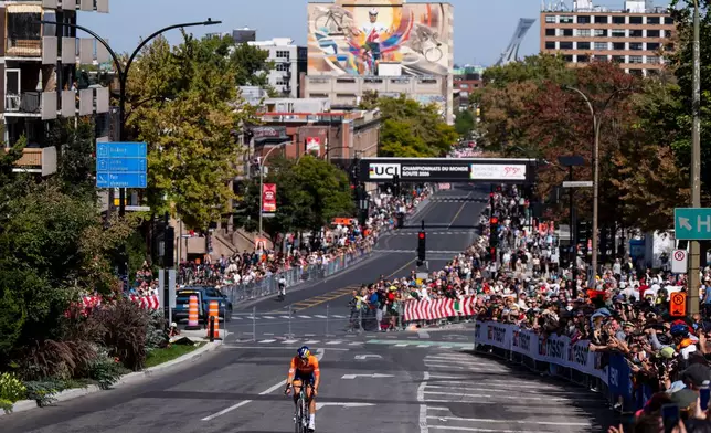 Demi Vollering, of the Netherlands, competes in the women's elite road race at the UCI Road World Championships cycling event in Montreal, Saturday, Sept. 26, 2026. (Christopher Katsarov/The Canadian Press via AP)