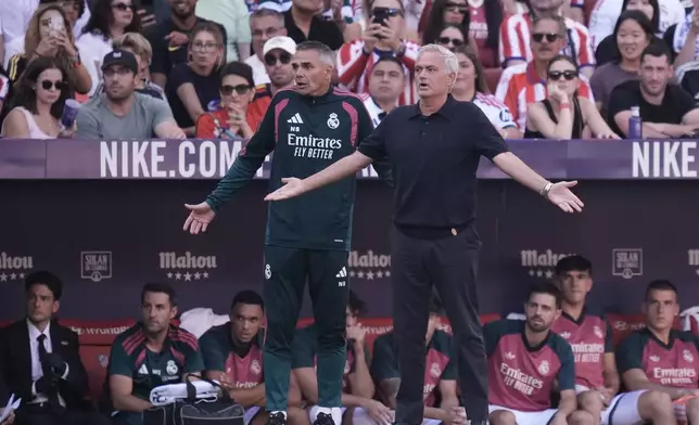 Real Madrid's head coach Jose Mourinho, right, gestures during a Spanish La Liga soccer match between Atletico Madrid and Real Madrid in Madrid, Sunday, Sept. 20, 2026. (AP Photo/Bernat Armangue)