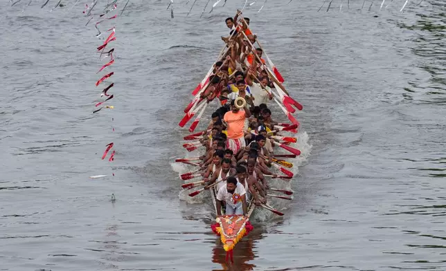 Participants take part in the traditional boat race on the Kulsi river in Champupara village, west of Guwahati, India, Thursday, Sept. 17, 2026. (AP Photo/Anupam Nath)