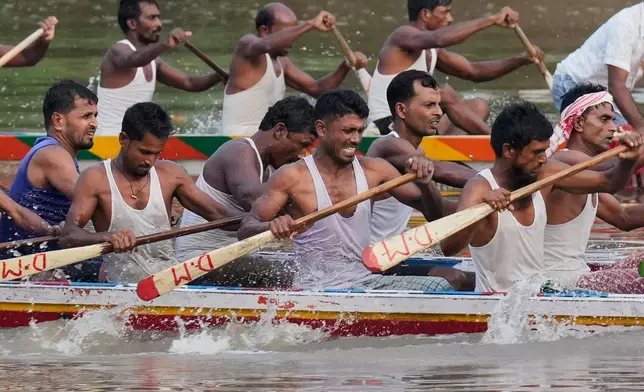 Participants take part in the traditional boat race on the Kulsi river in Champupara village, west of Guwahati, India, Thursday, Sept. 17, 2026. (AP Photo/Anupam Nath)