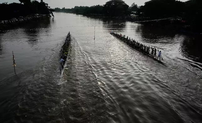 Participants take part in the traditional boat race on the Kulsi river in Champupara village, west of Guwahati, India, Thursday, Sept. 17, 2026. (AP Photo/Anupam Nath)