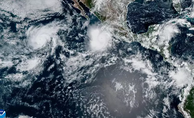 This satellite image provided by NOAA shows Hurricane Polo off the southwestern coast of Mexico and Hurricane Odalys, left, on Thursday, Sept. 24, 2026. (NOAA via AP) CORRECTION: Changes to Hurricane Odalys, not Tropical Storm Nolo.