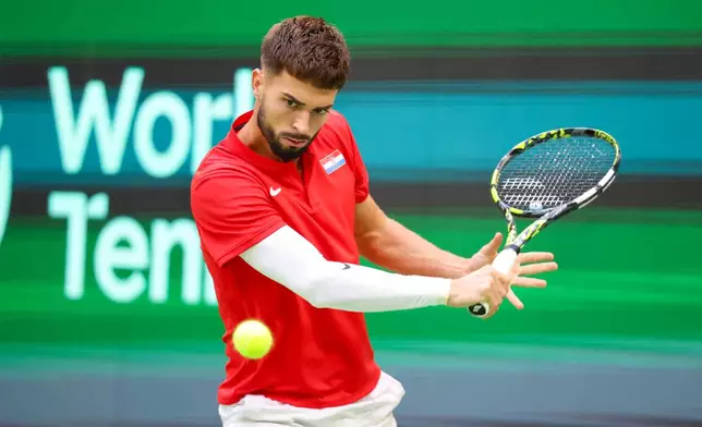 Croatia's Dino Prizmic plays Germany's Alexander Zverev during their Davis Cup tennis match in Halle, Germany, Sunday, Sept. 20, 2026. (Christoph Reichwein/dpa via AP)