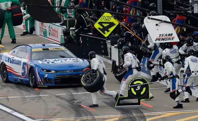 Kyle Larson makes a stop on pit road at the end of the first stage during a NASCAR Cup Series auto race in Kansas City, Kan., Sunday, Sept. 27, 2026. (AP Photo/Colin E. Braley)