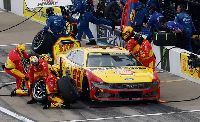 Joey Logano makes a stop on pit road at the end of the first stage during a NASCAR Cup Series auto race in Kansas City, Kan., Sunday, Sept. 27, 2026. (AP Photo/Colin E. Braley)