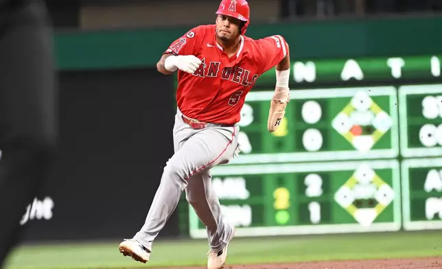 Los Angeles Angels' Vaughn Grissom heads to third base on a single hit by Moises Ballesteros during the second inning of a baseball game against the Pittsburgh Pirates, Friday, Sept. 4, 2026, in Pittsburgh. (AP Photo/Philip G. Pavely)