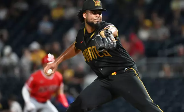 Pittsburgh Pirates relief pitcher Wilber Dotel throws to the Los Angeles Angels during the seventh inning of a baseball game, Friday, Sept. 4, 2026, in Pittsburgh. (AP Photo/Philip G. Pavely)