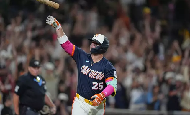 San Diego Padres' Ty France celebrates after hitting a three-run home run during the fifth inning of a baseball game against the Miami Marlins Friday, Sept. 18, 2026, in San Diego. (AP Photo/Gregory Bull)