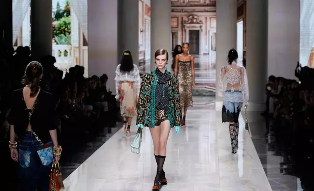 A model wears a creation part of Dolce & Gabbana women's Spring-Summer 2027 collection, presented in Milan, Italy, Saturday, Sept. 26, 2026. (AP Photo/Luca Bruno)